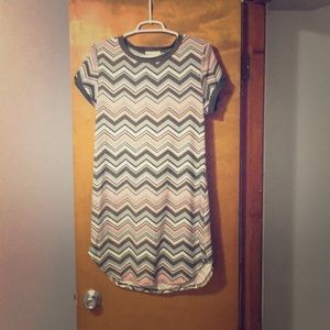 Knee length fitted dress.